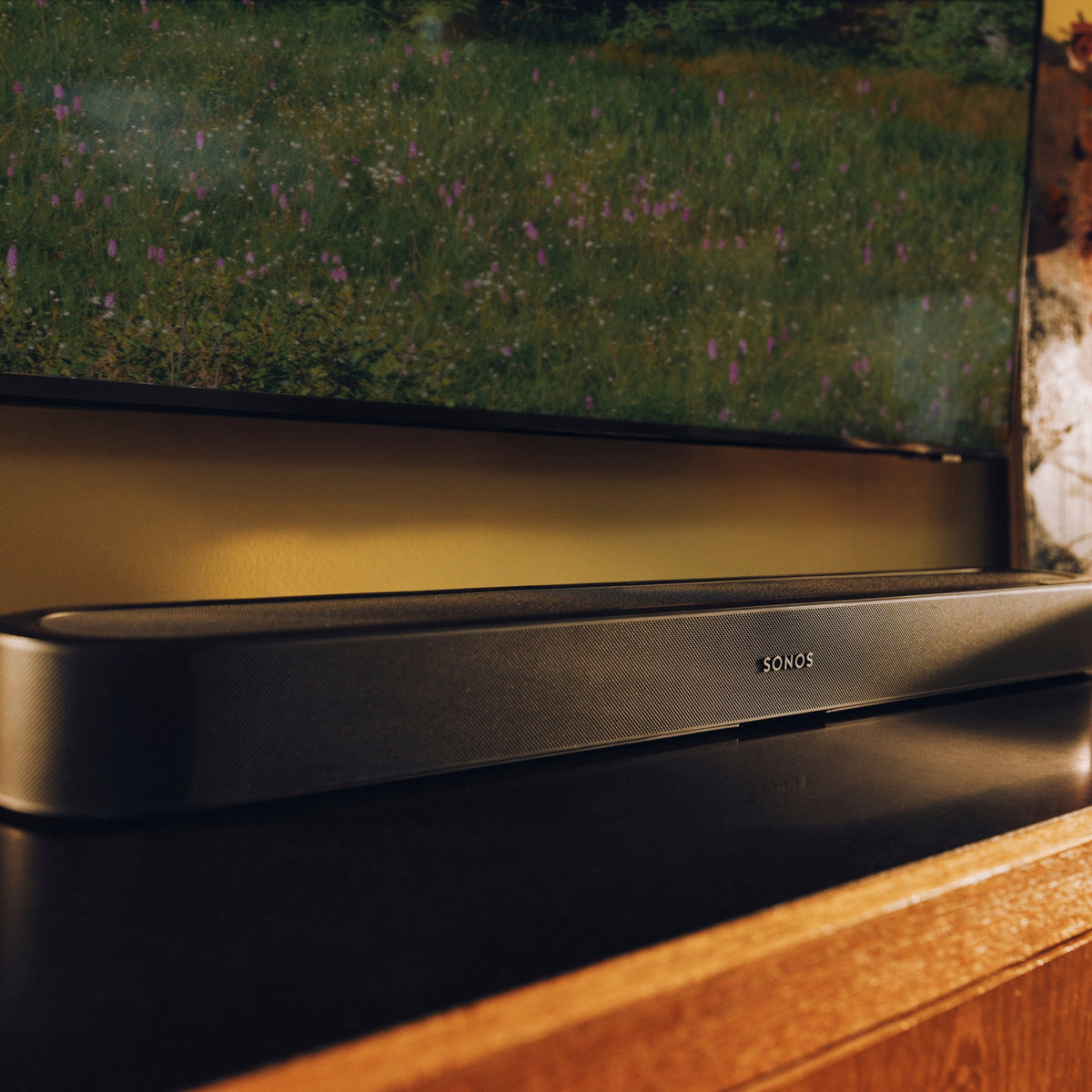 Black Sonos Beam Ultra positioned below a television