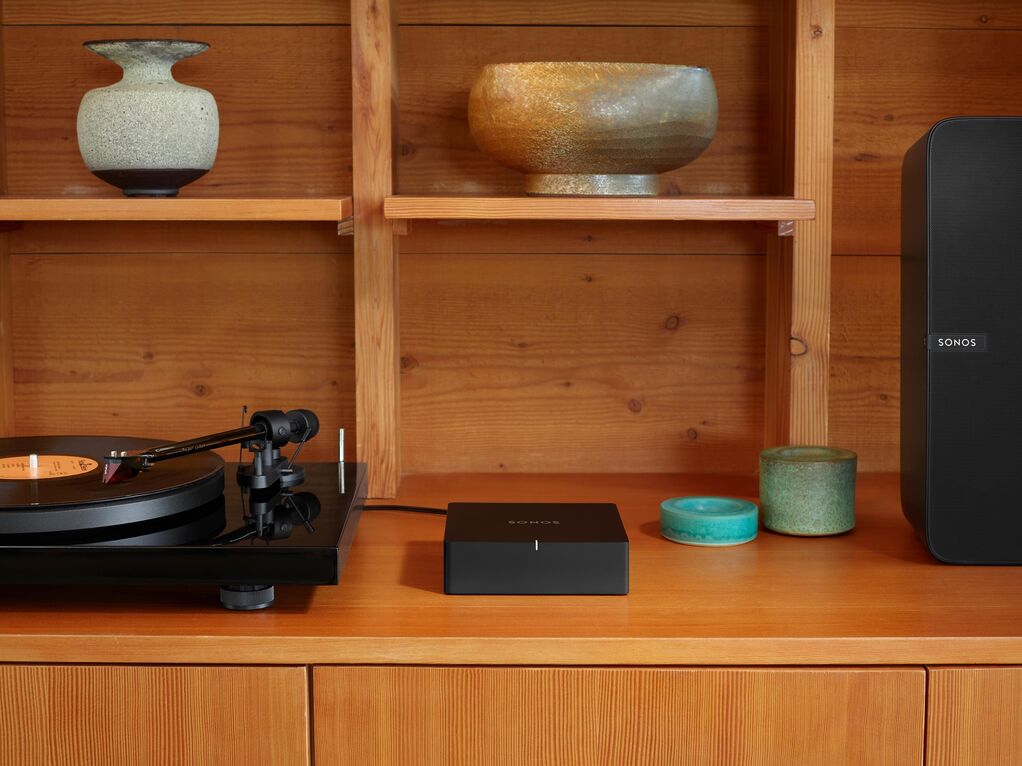 Sonos Port beside a turntable in an existing home audio system